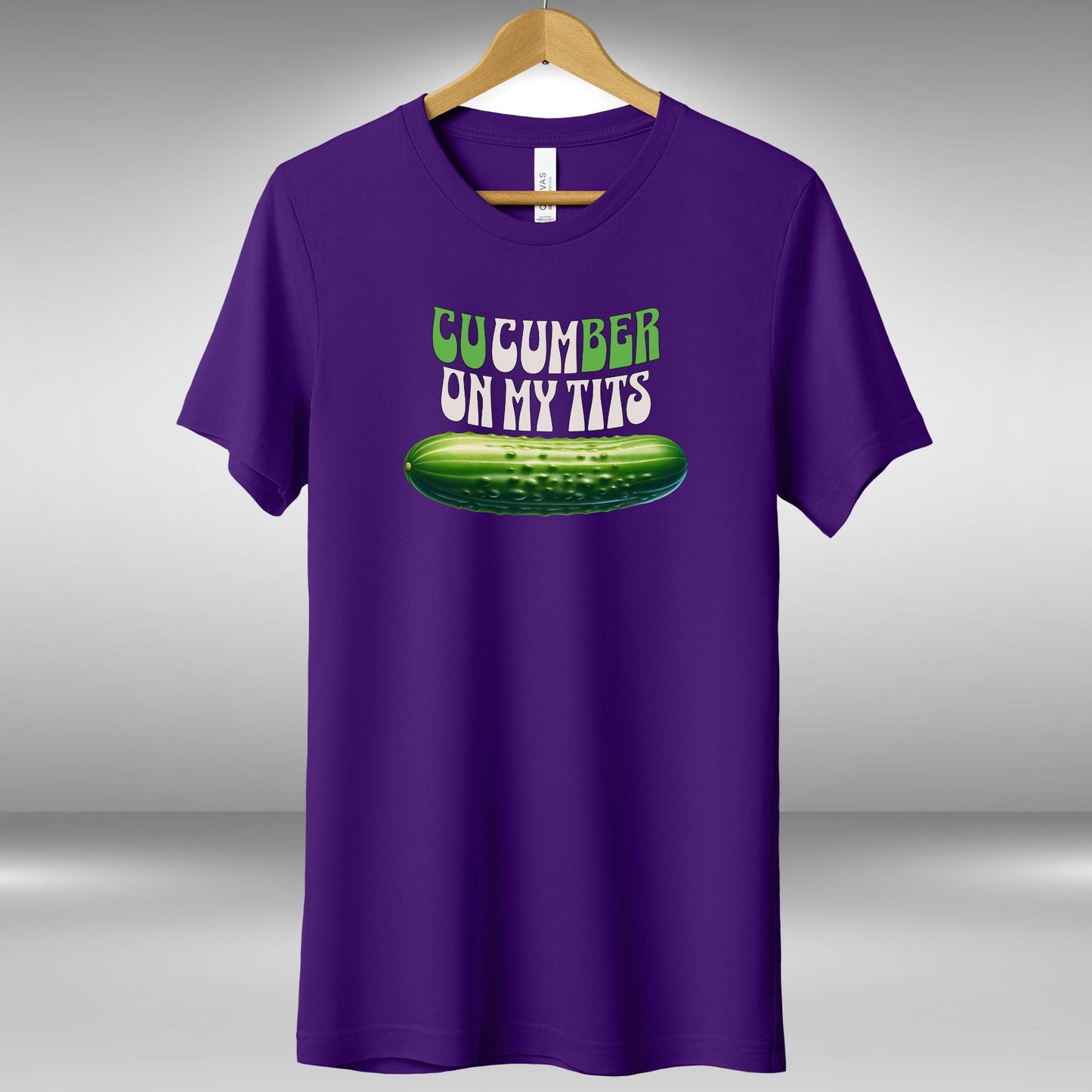 a purple shirt that says cucumber on my tits
