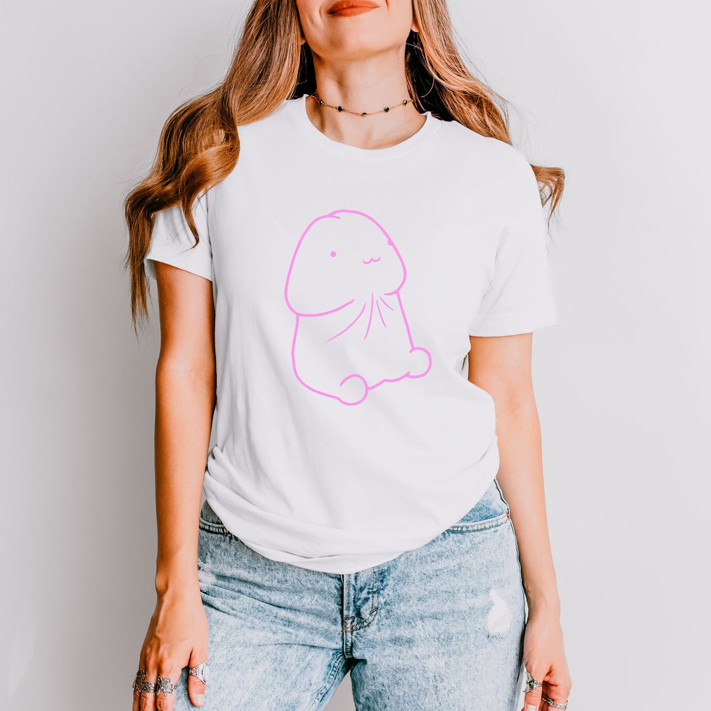 a woman wearing a white t - shirt with a pink elephant on it
