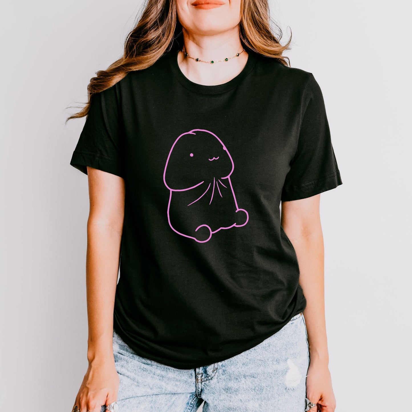 a woman wearing a t - shirt with a drawing of a dog on it
