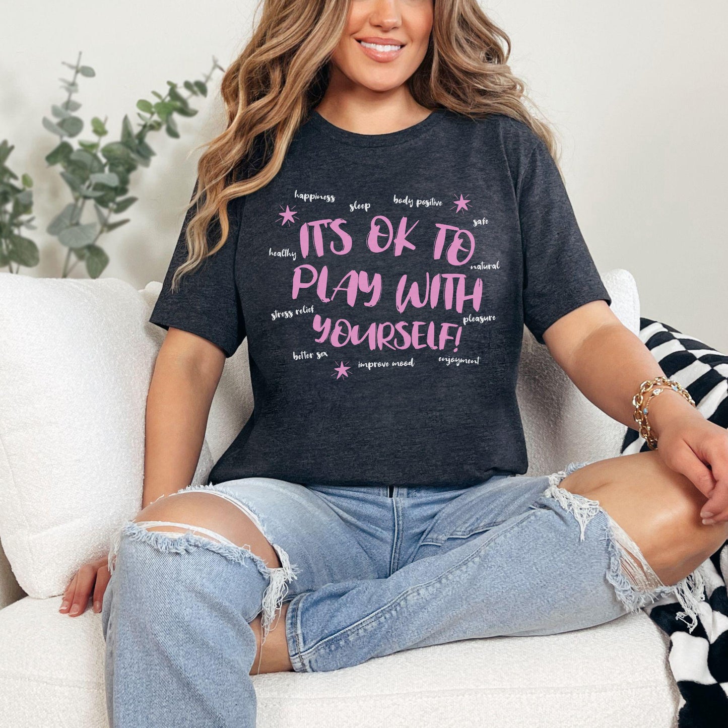 a woman sitting on a couch with her legs crossed