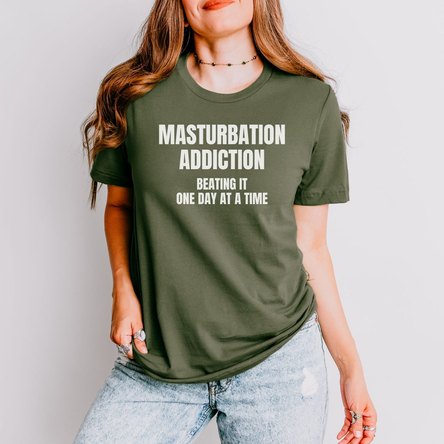 a woman wearing a t - shirt that says masturption addition being it one