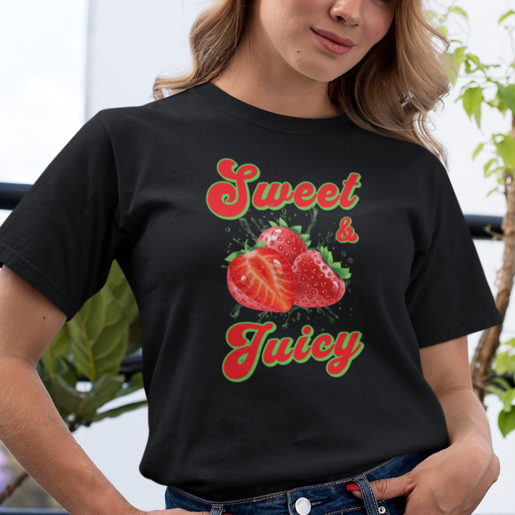 a woman wearing a black t - shirt with a strawberry on it