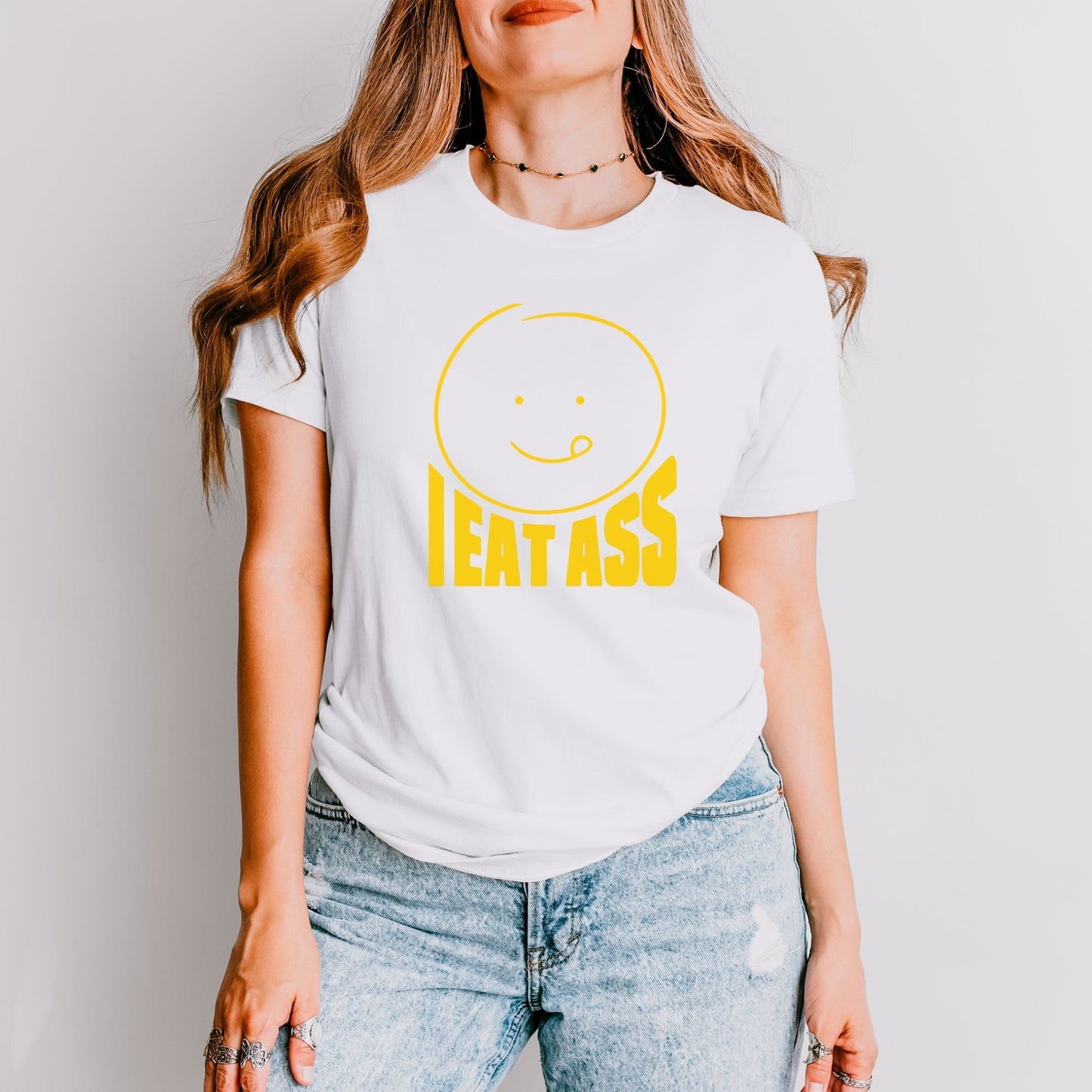a woman wearing a t - shirt that says eat ass