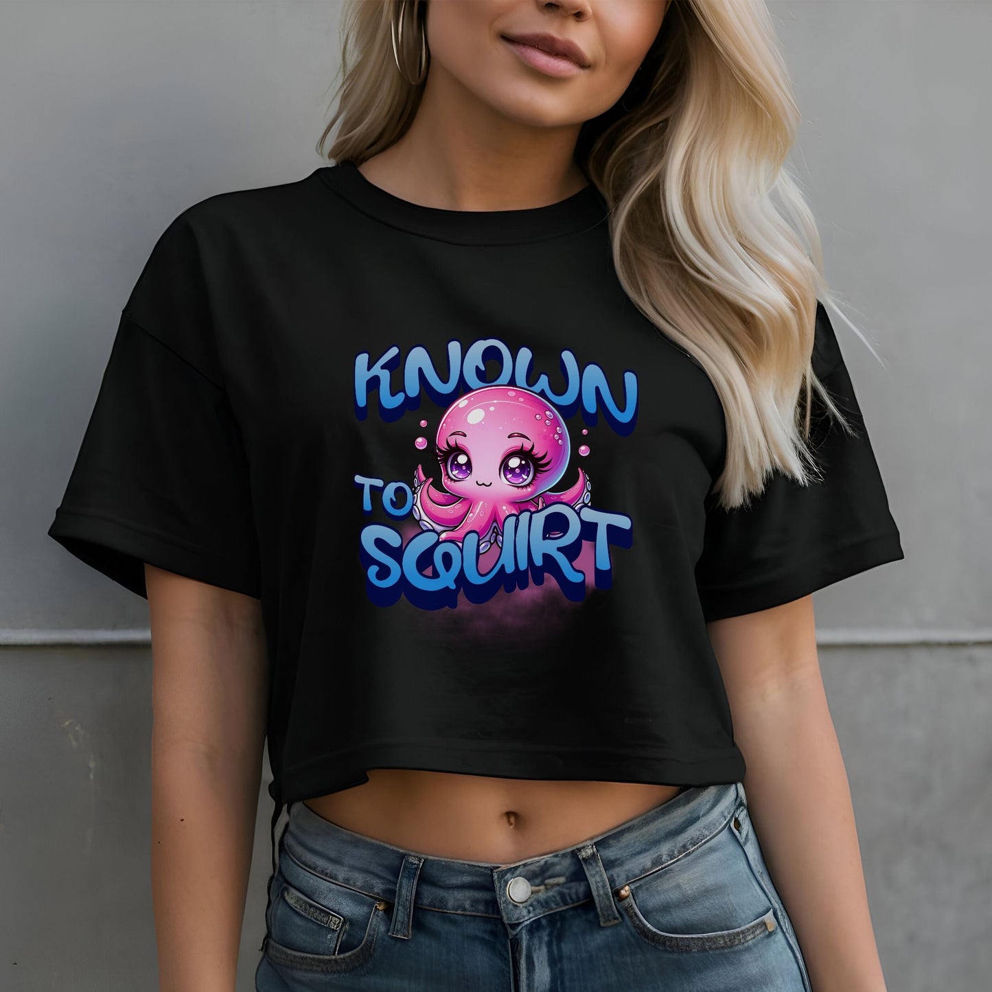 a woman wearing a black shirt with a pink octopus on it