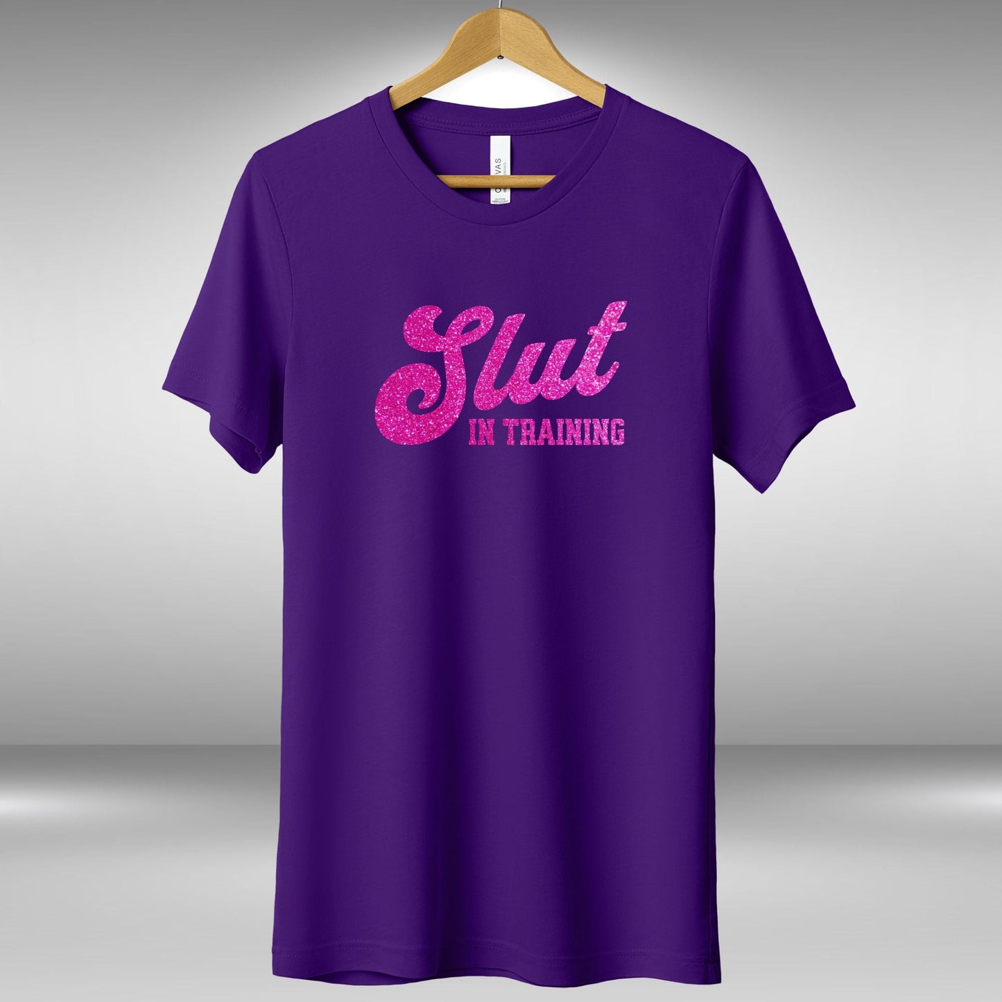 a purple shirt that says slut in training