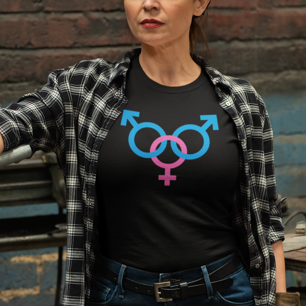 a woman wearing a black shirt with a pink and blue symbol on it