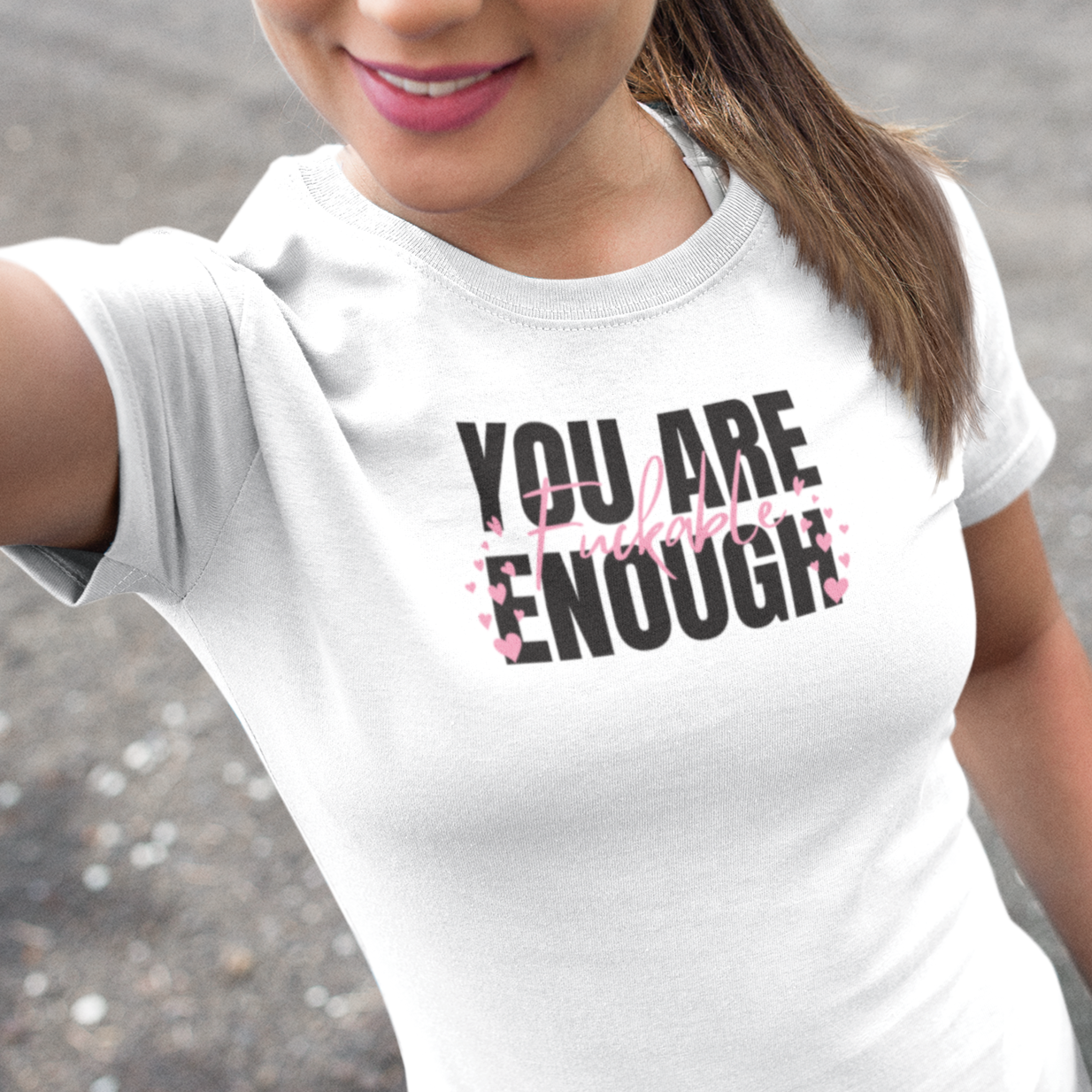 a woman wearing a t - shirt that says you are enough