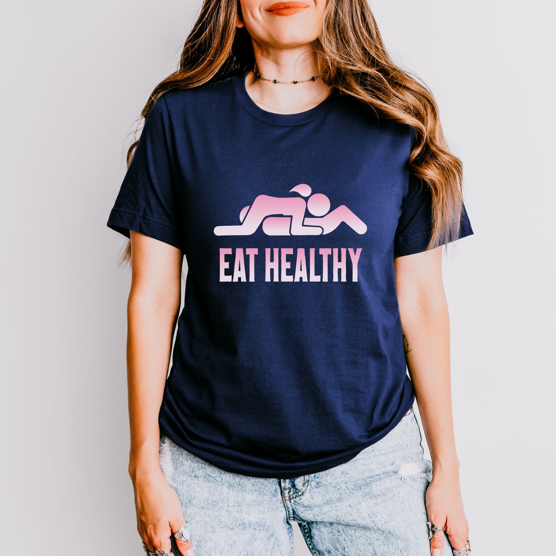 a woman wearing a t - shirt that says eat healthy