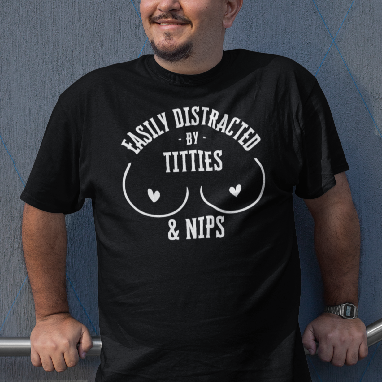 a man wearing a black shirt that says easily distracted by tittles and ni