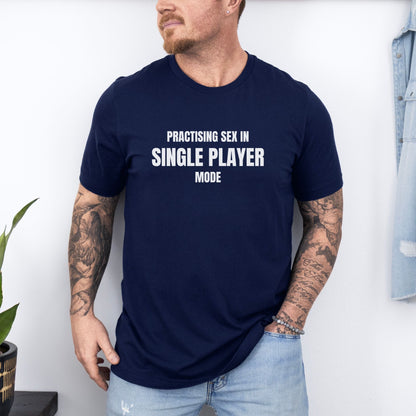 a man with a beard wearing a blue shirt