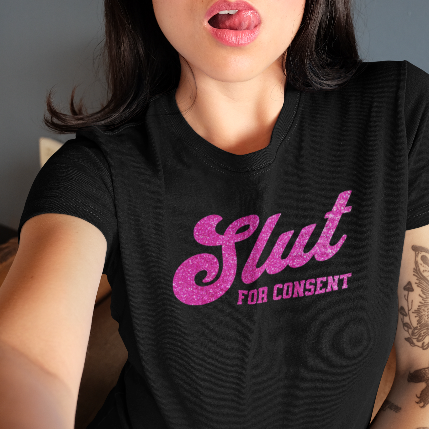 a woman wearing a shirt that says slut for content