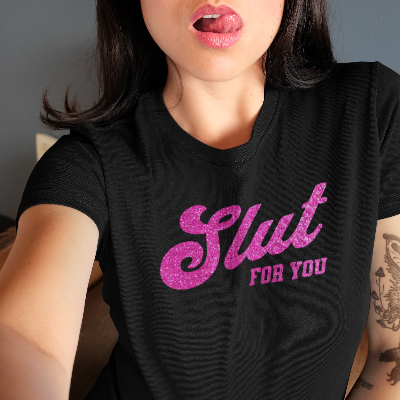 a woman making a funny face with her tongue out