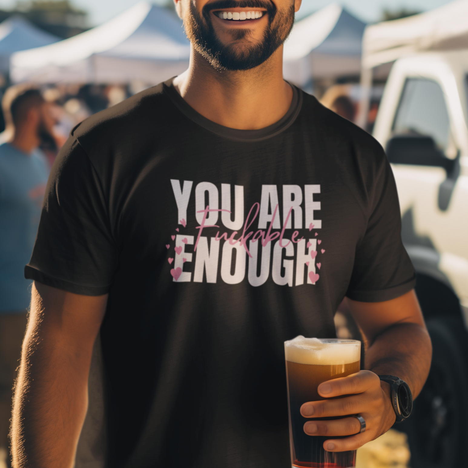 a man holding a glass of beer in his hand
