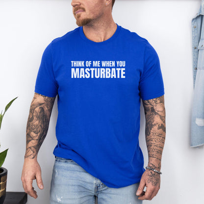 a man wearing a blue t - shirt that says, think of me when you