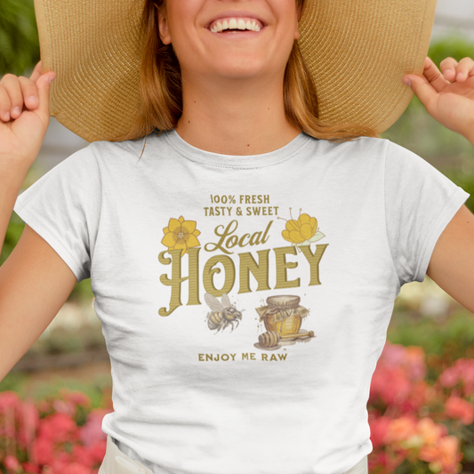 a woman wearing a straw hat and a local honey t - shirt