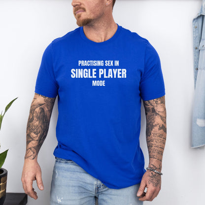 a man wearing a blue t - shirt that says practicing sea in single player mode