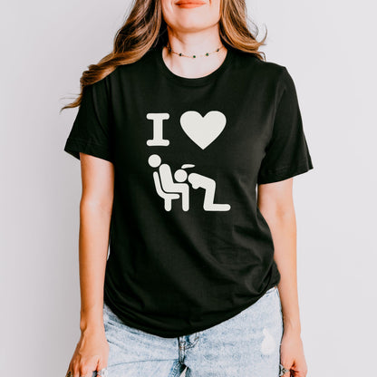 a woman wearing a black t - shirt with a white graphic of a man and
