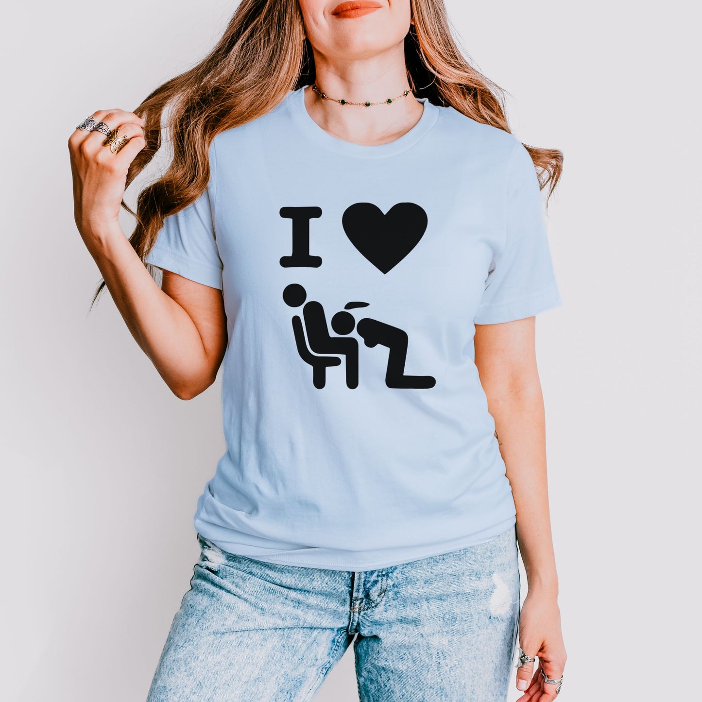 a woman wearing a t - shirt with a picture of a man and a woman