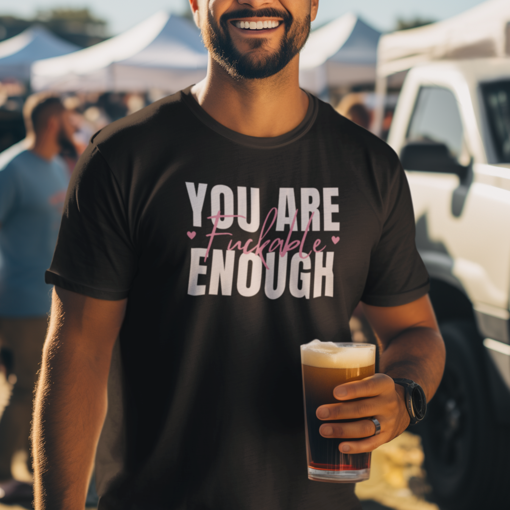a man holding a glass of beer in his hand